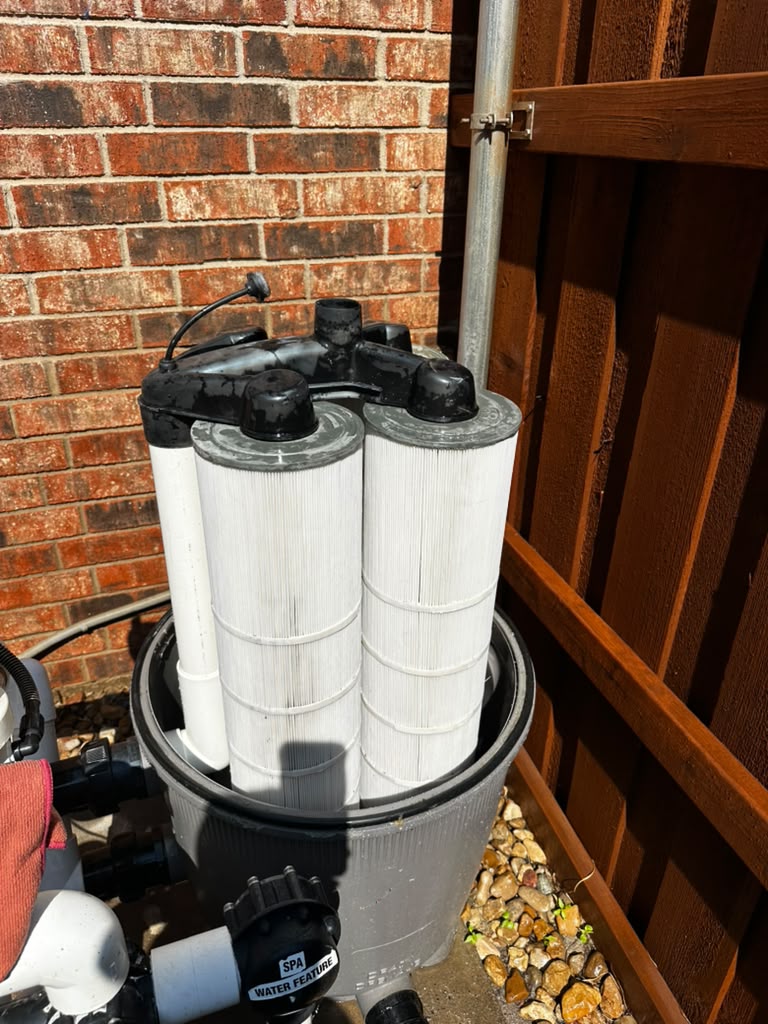 The same filter cartridges cleaned to bright white