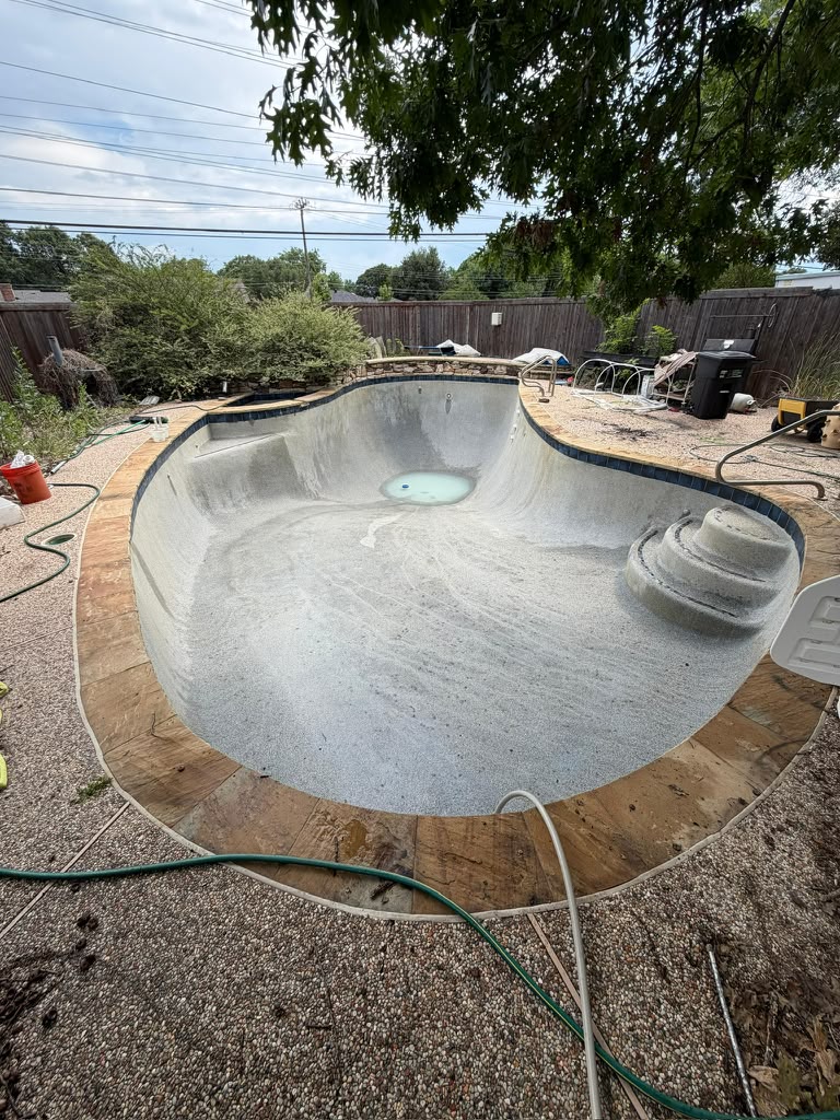 The same drained pool after leaves and debris were removed