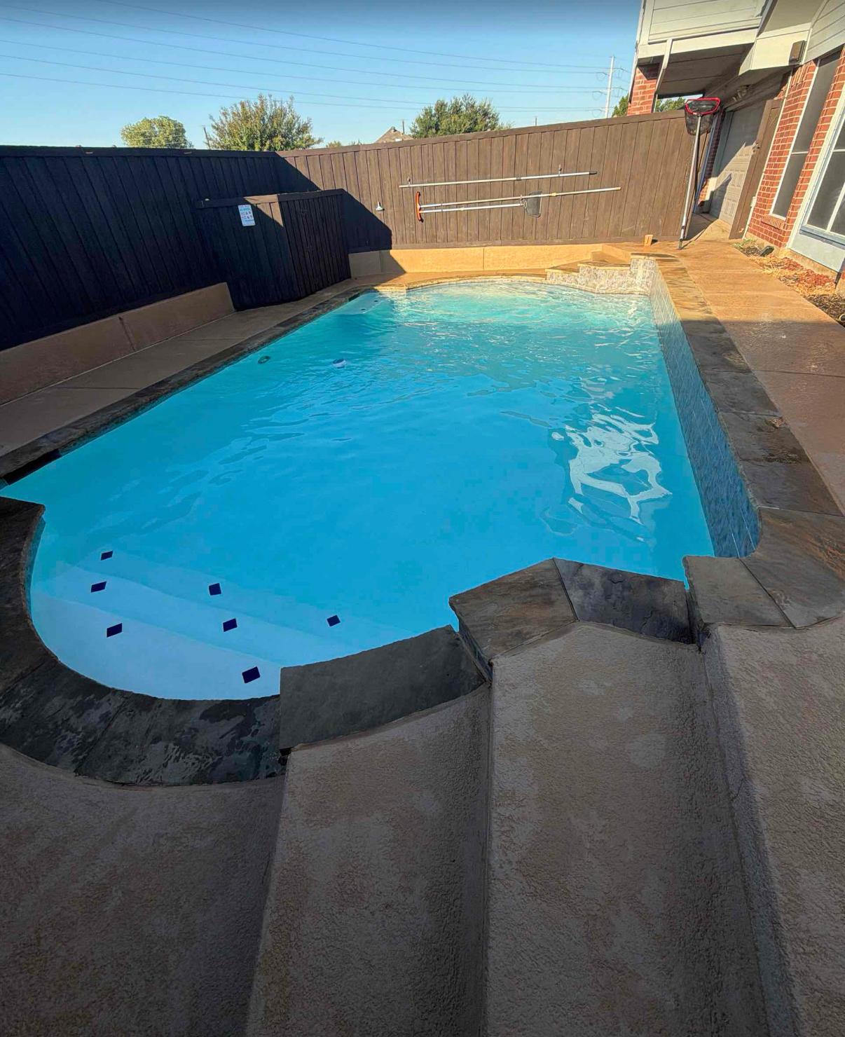 The same pool refilled with clear blue water